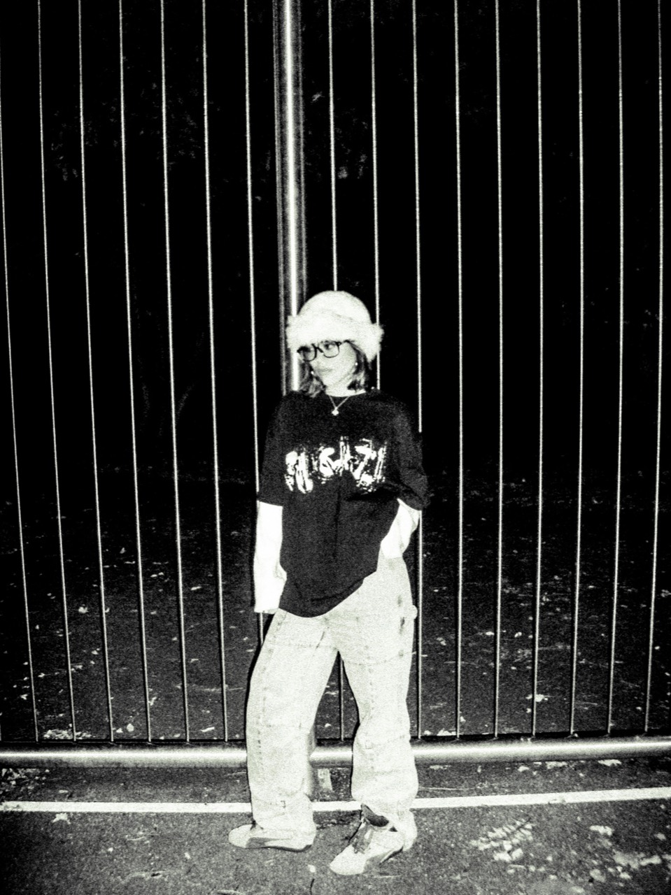 Full-body photograph wearing the FUGAZI shirt